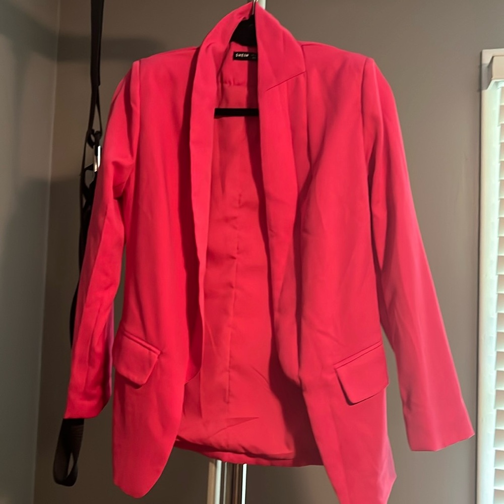 Pink blazer in size xs. New w/out tags